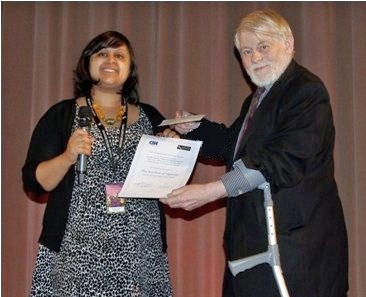 Griffith Vaughan Williams presents the certificate to Nazmia Jamal